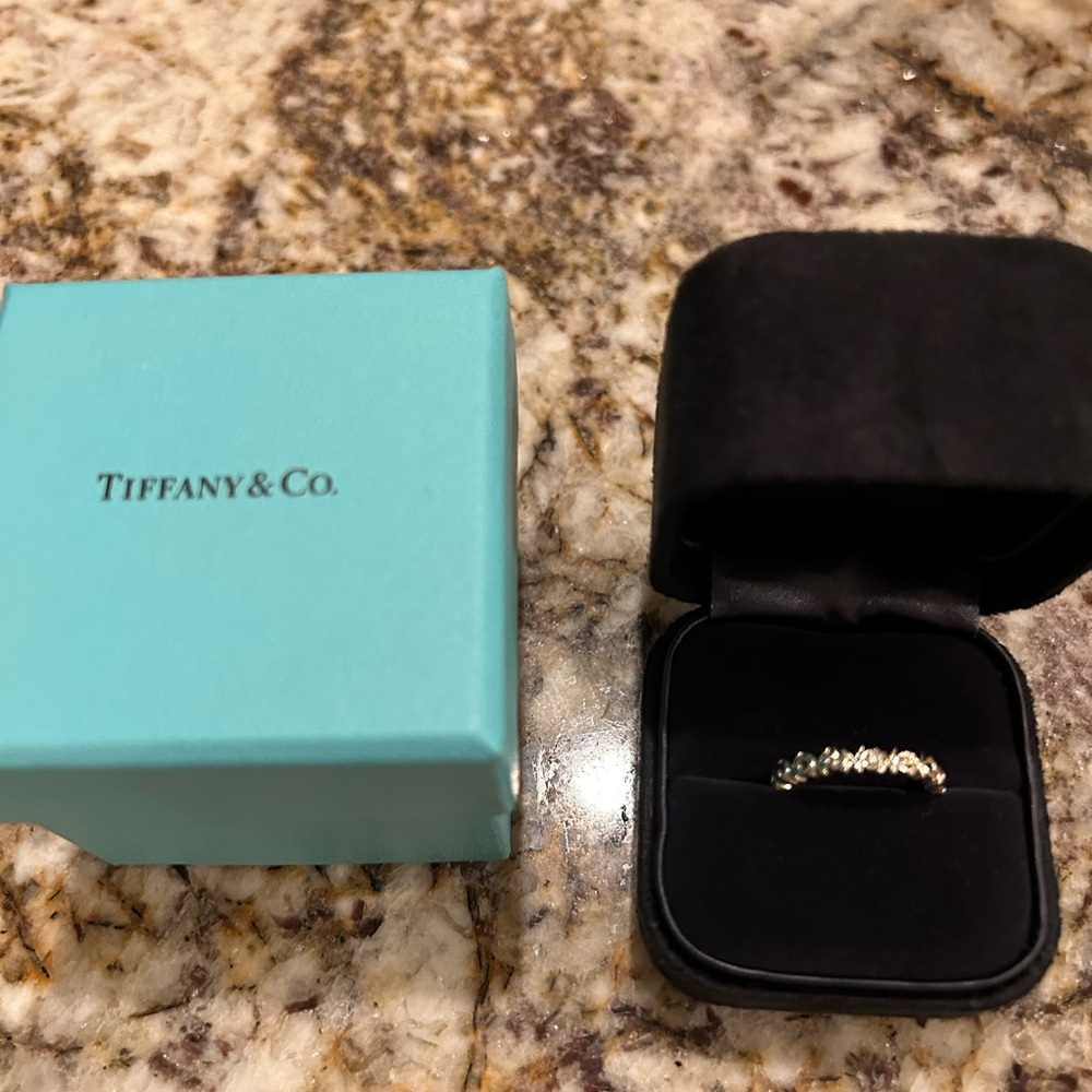 Tiffany & Company 18K White Gold XOXO band with 3 Diamonds in the center